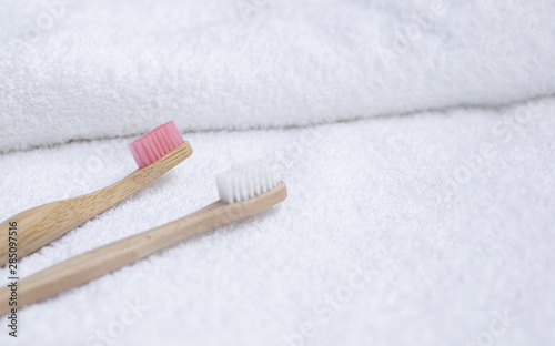 High angle toothbrushes on white towel