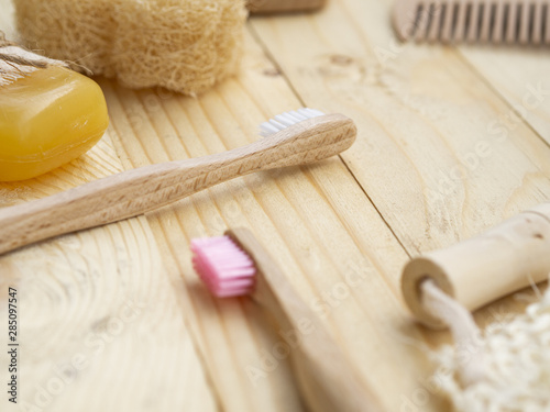 High angle arrangement with brushes on wooden background photo