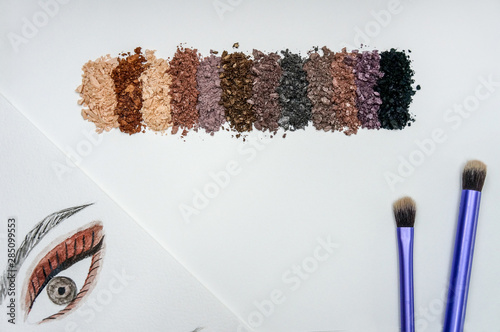 Crushed eye shadow makeup set isolated on white background photo