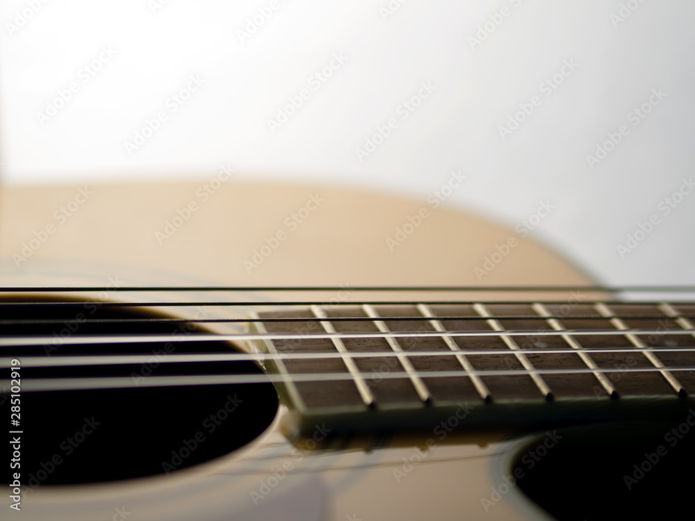 Fototapeta premium six - string acoustic guitar on a white background. music day