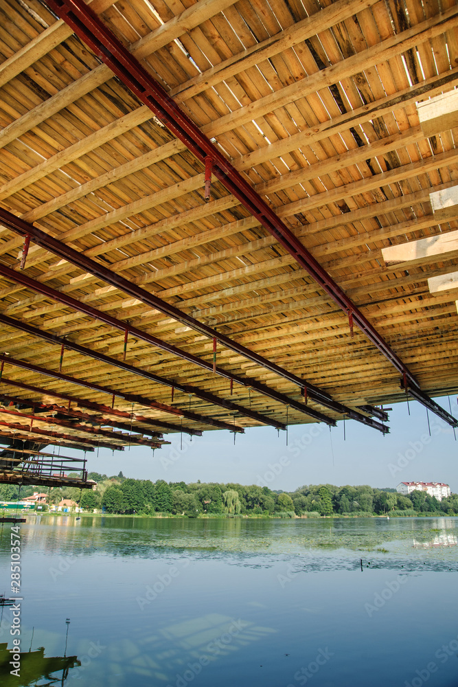 Wooden platform for installing formwork and scaffolding during the reconstruction of the bridge