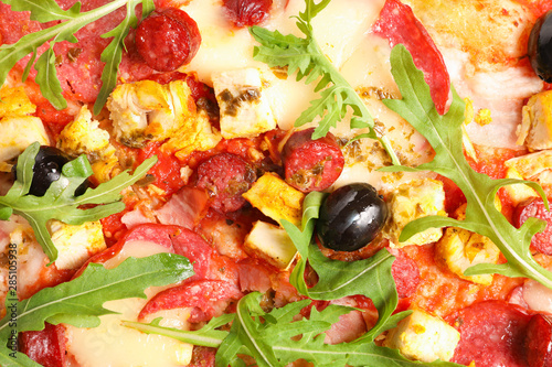 Pizza with olives and arugula on whole background, closeup