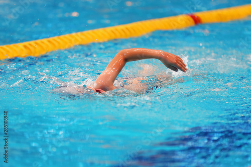 Young swimmer trains in the pool with clean water © makedonski2015