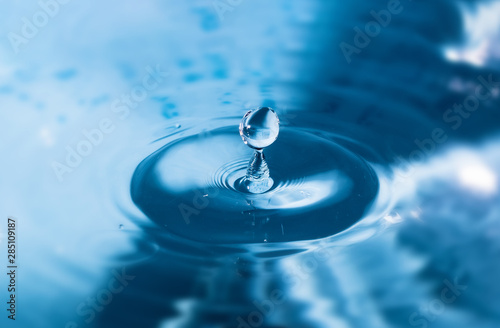 Water splash close-up. Drop of water. Blue water drop. Falling water