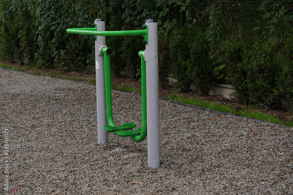 outdoor green-gray iron exercise machine for sports. public gym, muscle building, exercise outdoor green-gray iron exercise machine for sports. public gym, muscle building, exercise