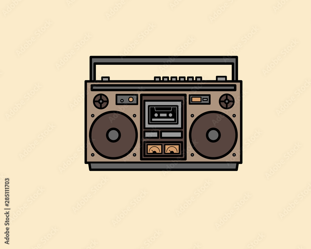 Retro portable stereo boombox radio cassette player from 80s on beige background Retro portable stereo boombox radio cassette player from 80s on beige background