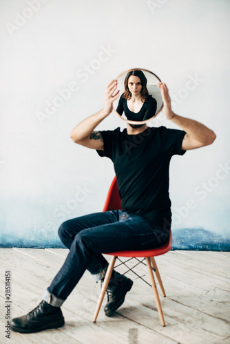Man reflecting woman with mirror