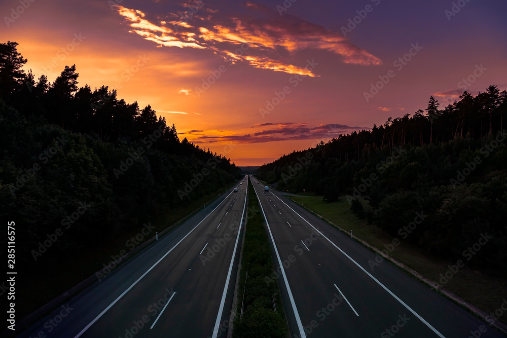 Empty highway at sunset 