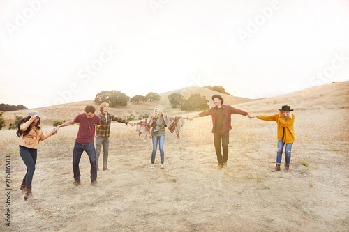 Group of friends doing a human chain together
