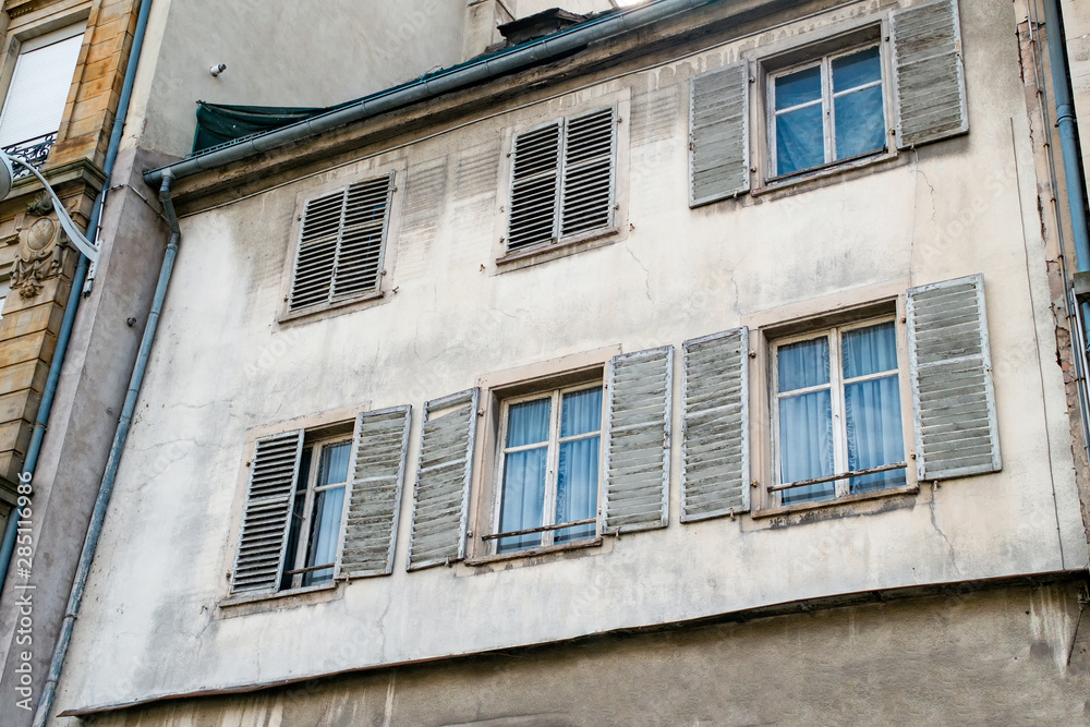 facade of a building, old windows with shutters