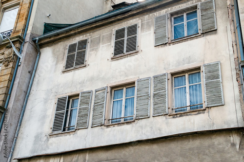 facade of a building, old windows with shutters