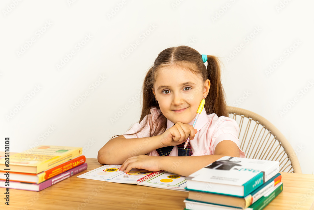 Girl studing at table on white background Girl studing at table on white background