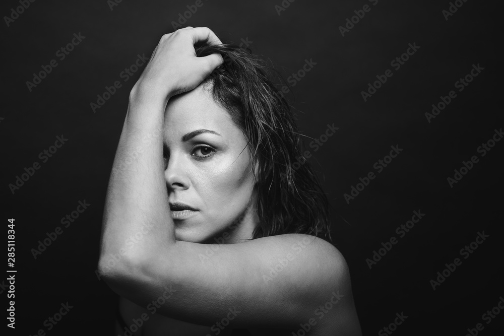 Black and white portrait of a young pensive woman Black and white portrait of a young pensive woman
