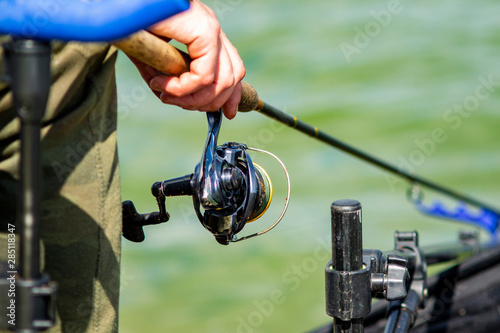 angler with fishing rod on the lake