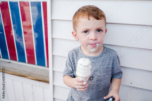 little kid eating ice cream photo