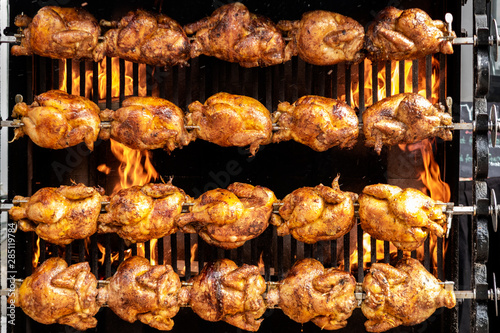Street food: Chicken being grilled on large grill