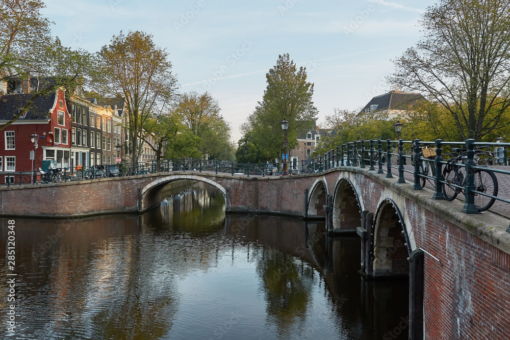 One of the many bridges over a canal in Amsterdam Netherlands