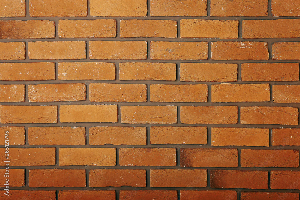 Obraz premium Yellow brick wall. Texture, wallpaper background.