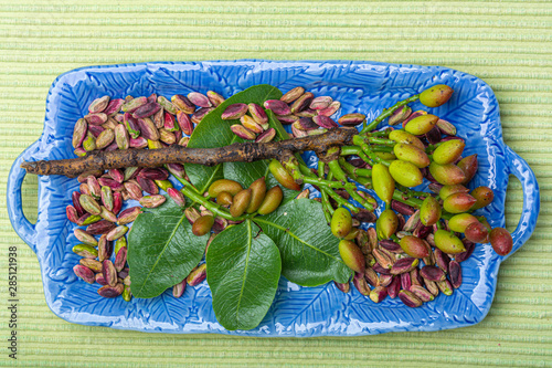 Emerald green pistachios nuts from town Bronte, located on slopes of Mt. Etna, Sicily, Italy regional product photo