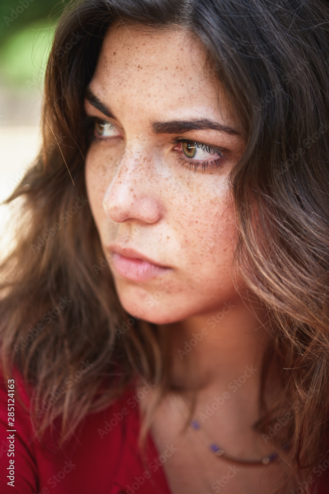 close up portrait of worried woman looking away close up portrait of worried woman looking away
