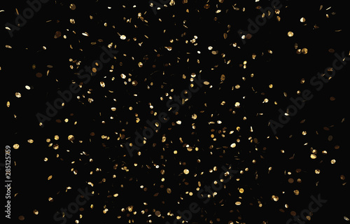 Glittering confetti on the black background. 
