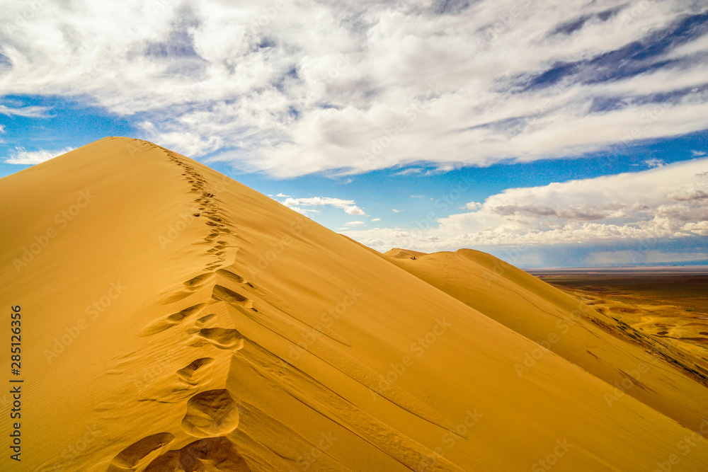 Khongor Sand Dunes in Gobi Desert (Mongolia) with single foot steps in den sand.