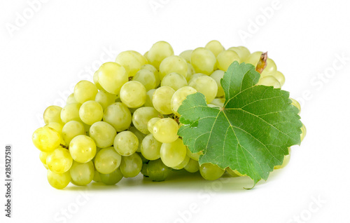 Green grape with leaves isolated on white