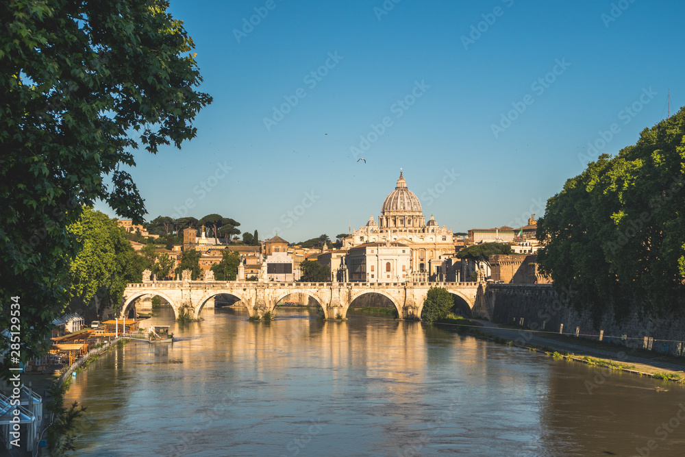 Vatican dome of Saint Peter Basilica (Italian: San Pietro) and Sant'Angelo Bridge, over Tiber river, Rome, Italy, Europe