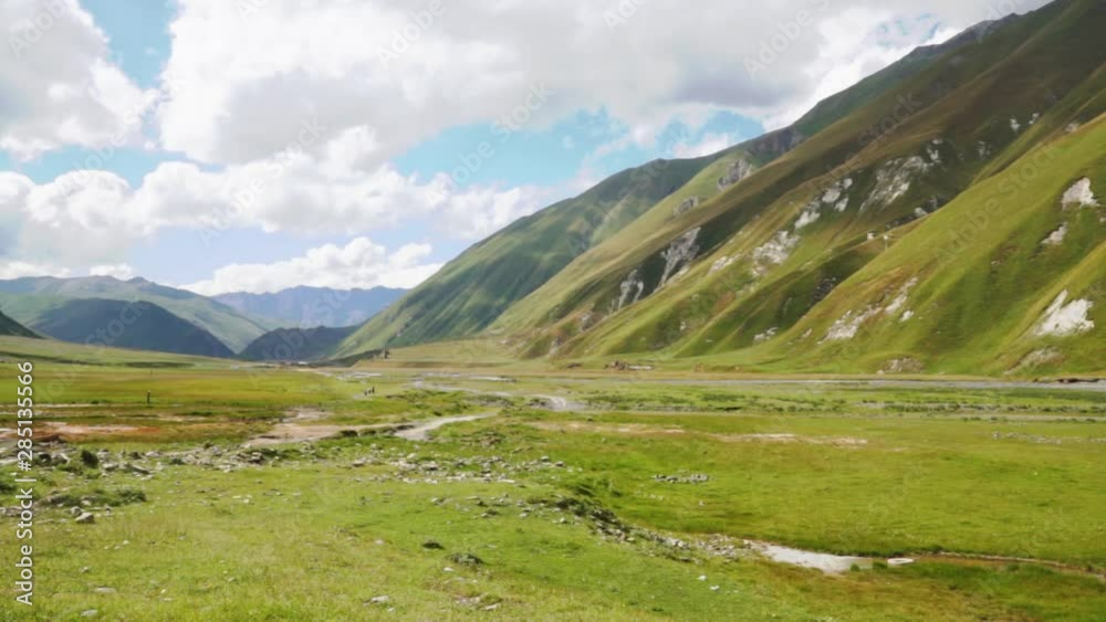 Truso Valley and Gorge area landscape on trekking / hiking route, in Kazbegi, Georgia. Truso valley is a scenic trekking route with river and mountains close to the border of North Ossetia. Truso Valley and Gorge area landscape on trekking / hiking route, in Kazbegi, Georgia. Truso valley is a scenic trekking route with river and mountains close to the border of North Ossetia.