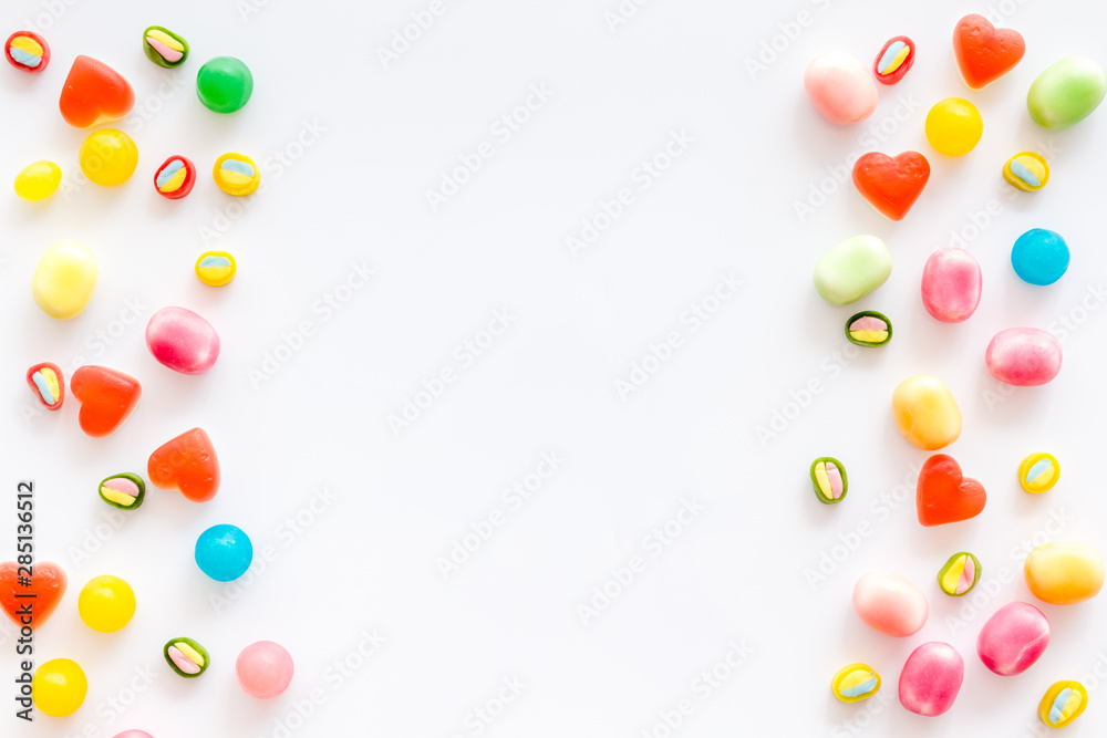 Candies frame for party design on white background top view copyspace