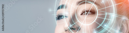 Woman with electronic information analysing inside eye