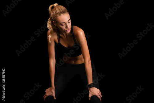 Slim Young Lady Taking Working Out Break On Black Background