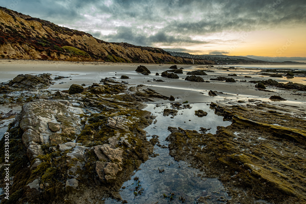 Fototapeta premium Good morning!! Crystal Cove State Park. Lovely morning walk with gorgeous light, clouds, stones formation, and ocean view.