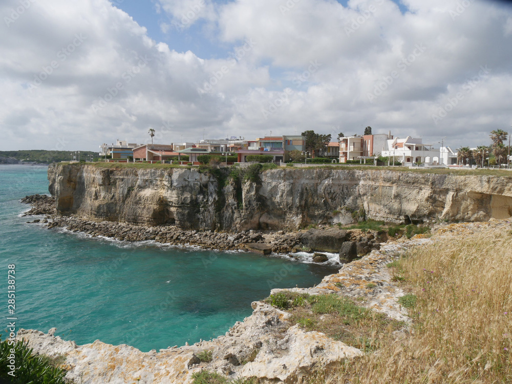 Torre dell'Orso in Salento is a touristic village in the Adriatic coast of Italy famous for its white beach with turquoise water sorrounded by jagged rocky and a green pine forest.