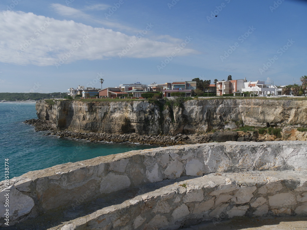 Torre dell'Orso in Salento is a touristic village in the Adriatic coast of Italy famous for its white beach with turquoise water sorrounded by jagged rocky and a green pine forest.