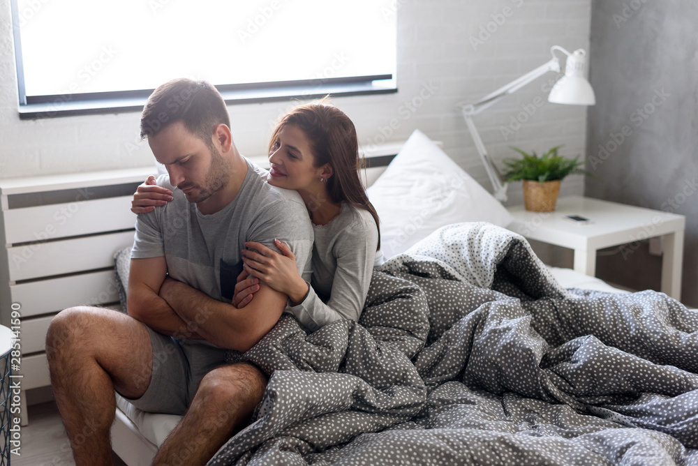Obraz premium Love couple in bed in the morning. Marriage problems. Sex problems