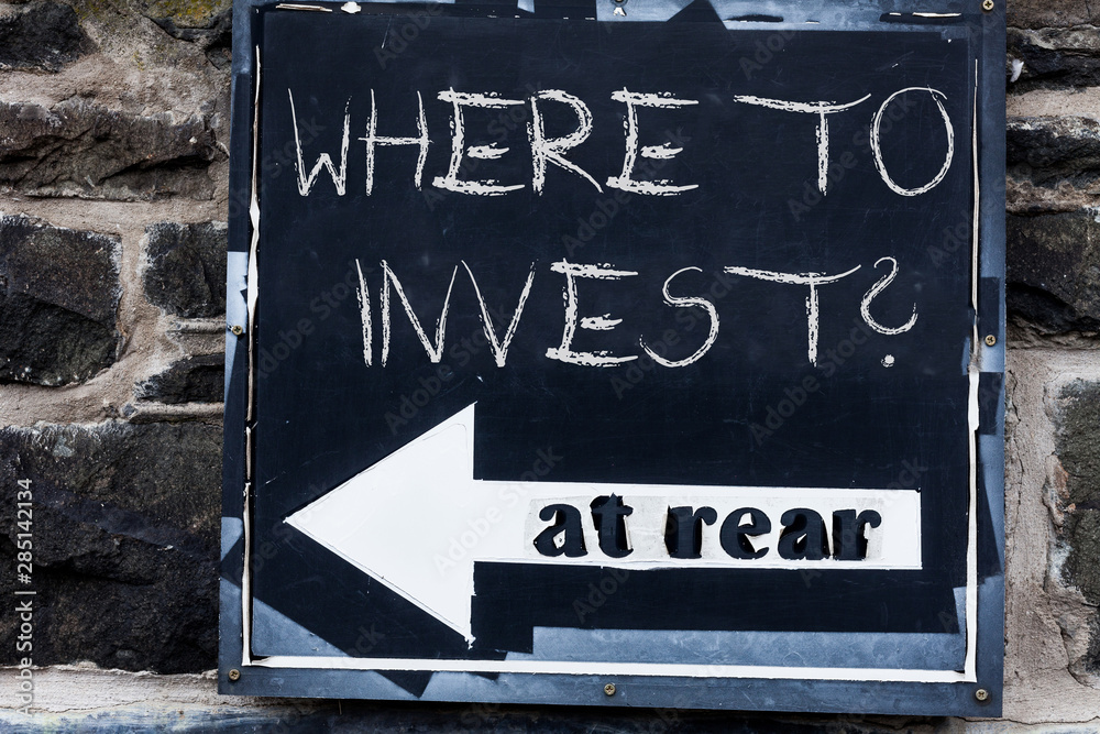 Obraz premium Word writing text Where To Invest Question. Business photo showcasing asking about where put money into financial schemes or shares Advertisement concept with empty copy space on the road sign