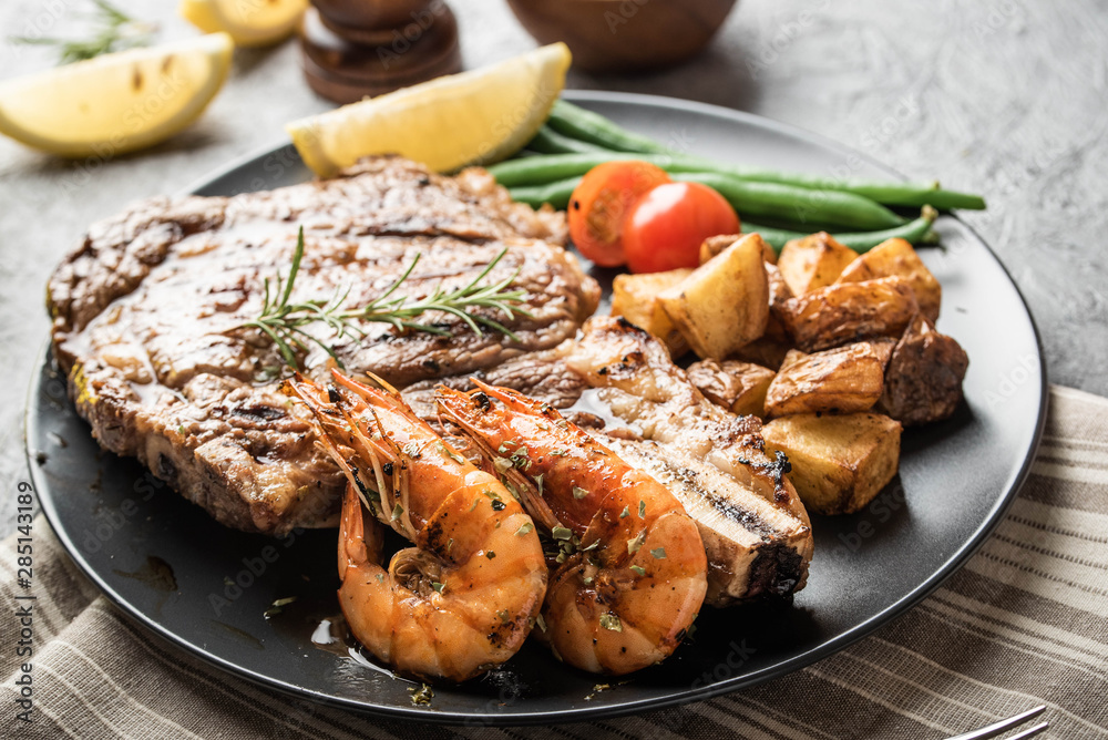 surf and turf, ribeye steak and grilled prawn surf and turf, ribeye steak and grilled prawn
