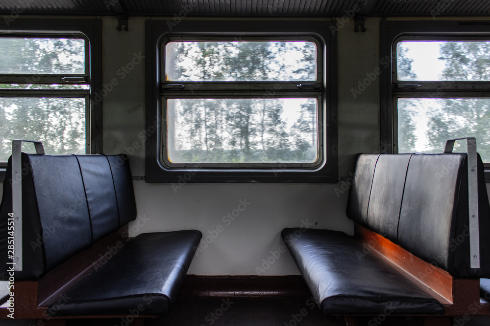 Empty seats inside passenger car of old electrical train Stock Photo