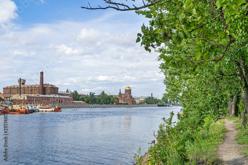 Ekateringofka River with the warehouse complex and the Church of the Epiphany in Saint Petersburg, Russia © laranik