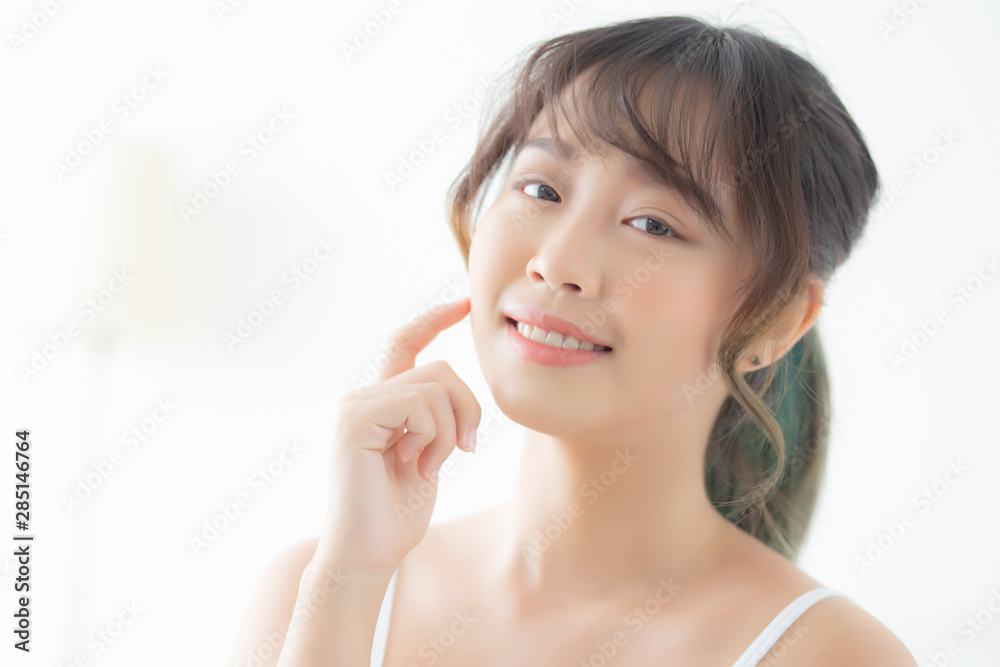 Portrait of beautiful young asian woman smile while wake up healthy and wellness with sunrise at morning in the bedroom, asia girl skin care with happy with fresh, lifestyle and relax concept. Portrait of beautiful young asian woman smile while wake up healthy and wellness with sunrise at morning in the bedroom, asia girl skin care with happy with fresh, lifestyle and relax concept.