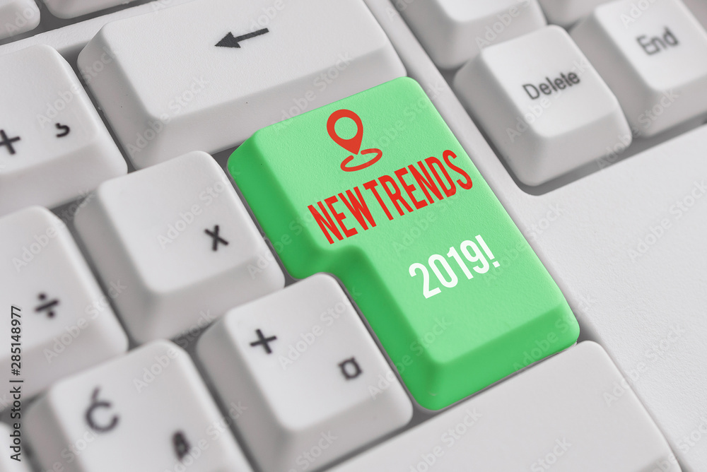 Text sign showing New Trends 2019. Business photo showcasing general direction in which something is developing White pc keyboard with empty note paper above white background key copy space Text sign showing New Trends 2019. Business photo showcasing general direction in which something is developing White pc keyboard with empty note paper above white background key copy space