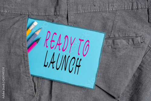 Conceptual hand writing showing Ready To Launch. Concept meaning an event to celebrate or introduce something new to market Writing equipment and blue note paper in pocket of trousers