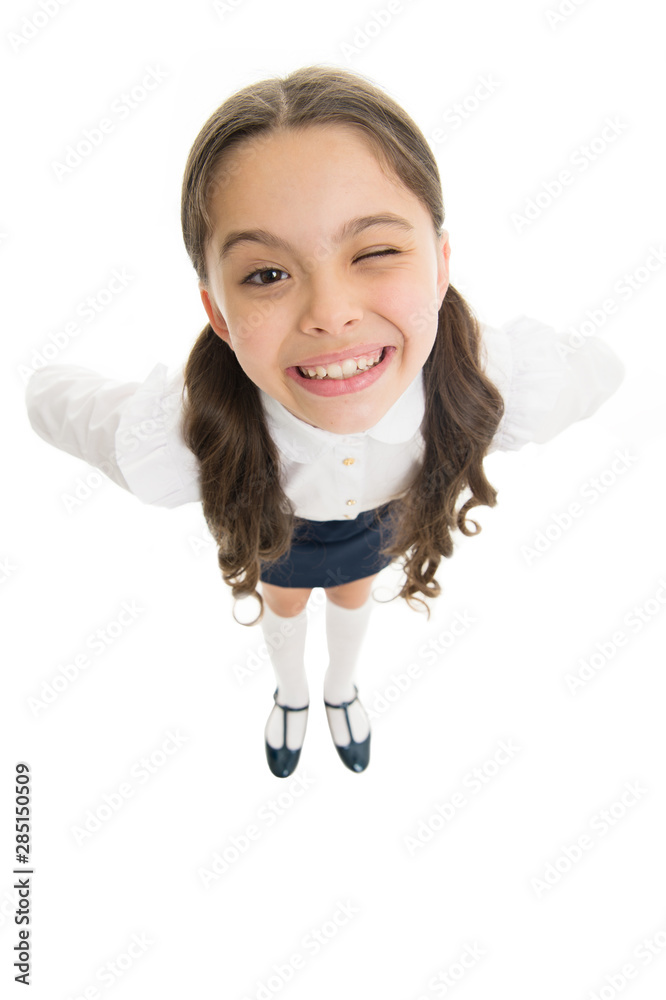 Cheerful smile. Student little kid adores school. Pupil of first grade. Celebrate knowledge day. September time to study. Girl cute pupil on white background. School uniform. Back to school Cheerful smile. Student little kid adores school. Pupil of first grade. Celebrate knowledge day. September time to study. Girl cute pupil on white background. School uniform. Back to school