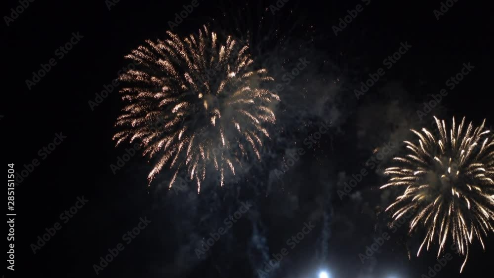 Firework display with large rockets in night sky Firework display with large rockets in night sky