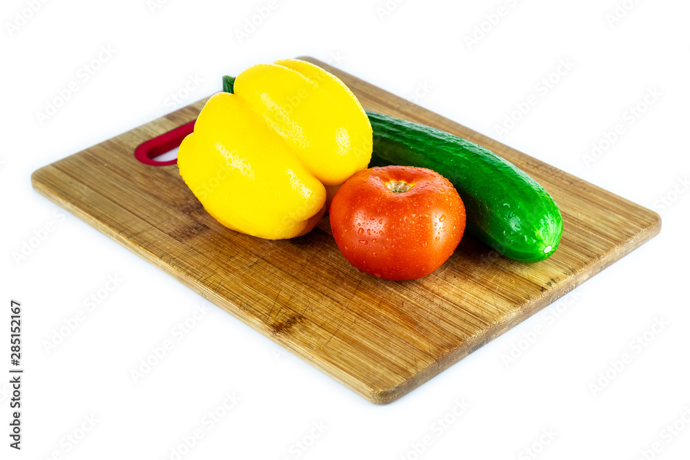 Fresh paprika, tomato, cucumber isolated on wooden blackboard. Organic vegetables. Healthy eating concept. Fresh paprika, tomato, cucumber isolated on wooden blackboard. Organic vegetables. Healthy eating concept.