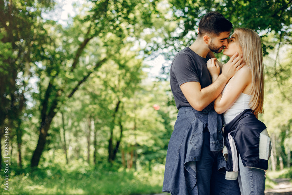 Couple in a forest. Beautiful blonde with her boyfriend Couple in a forest. Beautiful blonde with her boyfriend