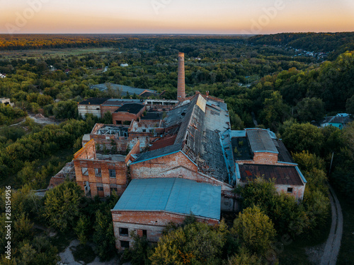 Ruined overgrown abandoned sugar factory in Ramon, aerial view