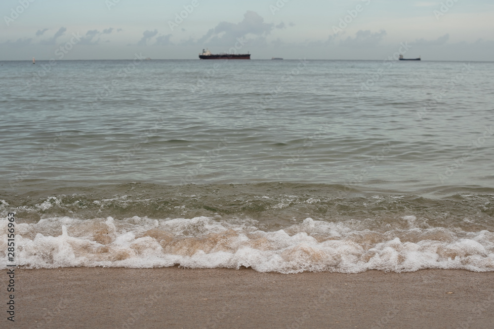 Waves Rolling into Shore during Blue Hour with Boats in the Ocean in Fort Lauderdale Waves Rolling into Shore during Blue Hour with Boats in the Ocean in Fort Lauderdale