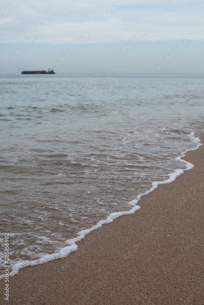 Waves Rolling into Shore during Blue Hour with Boats in the Ocean in Fort Lauderdale Waves Rolling into Shore during Blue Hour with Boats in the Ocean in Fort Lauderdale